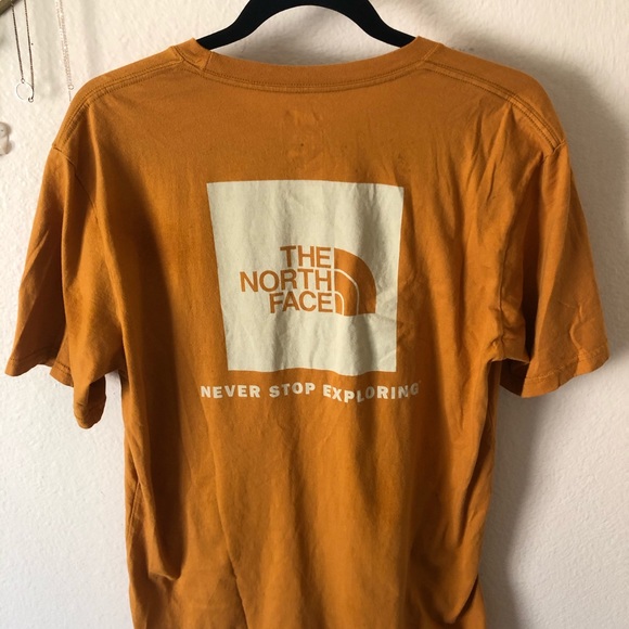 mustard north face t shirt